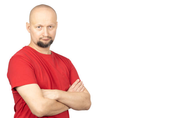 istock Man in red shirt standing with arms crossed 2191205539