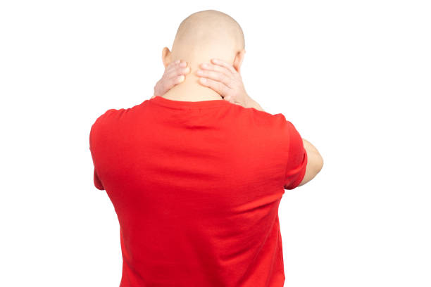 A woman suffering from stiff shoulders.
