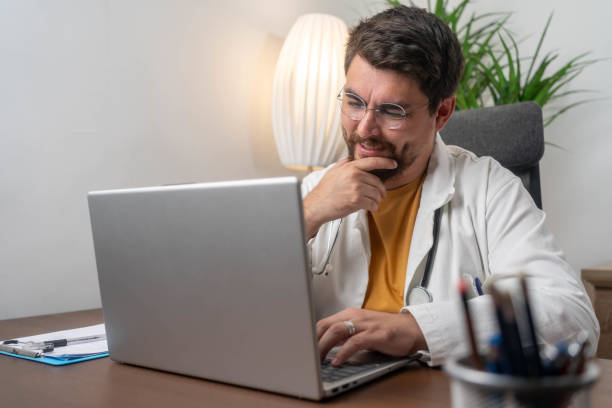 istock Mixed race doctor working on laptop 2191206434