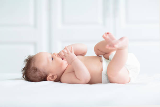 istock Little baby on white bed 2191207177
