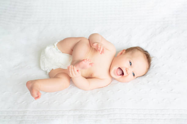 istock Little baby on white bed 2191207502