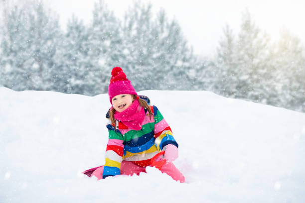 istock Girl on sled ride. Child sledding. Kid on sledge 2191207592