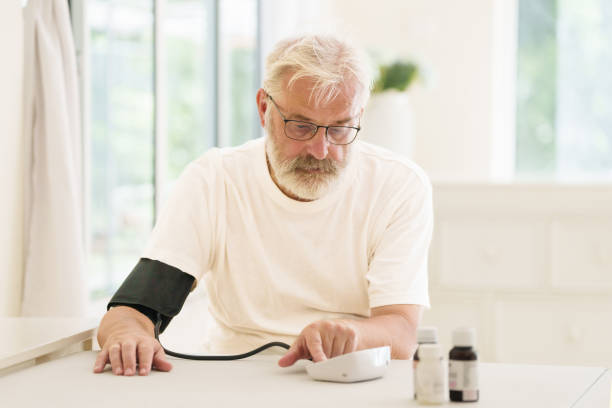 istock Senior man measuring blood pressure 2191207800