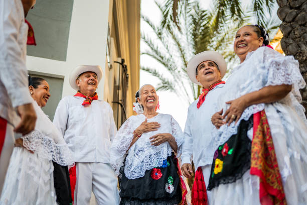 istock Senior traditional Mexican dancers talking outdoors 2191208241