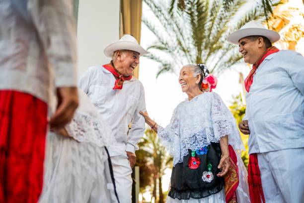 istock Senior traditional Mexican dancers talking outdoors 2191208253