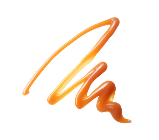 istock Pattern drawn with melted caramel close up isolated on a white background 2191209481