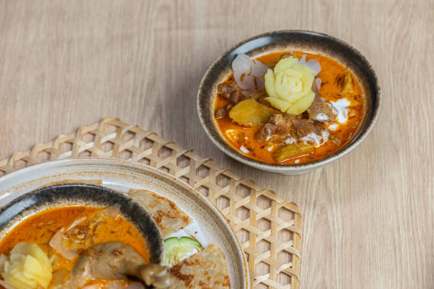 istock Massaman curry with roti. Massaman Curry with Chicken or Beef and Potatoes. Thai Massaman curry with chicken or beef halal food 2191210023