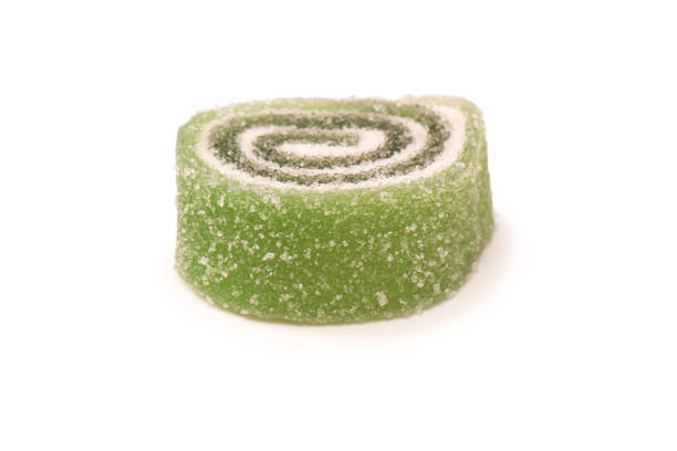 Jelly sweet candy roll isolated on a white background. Marmalade candy.
