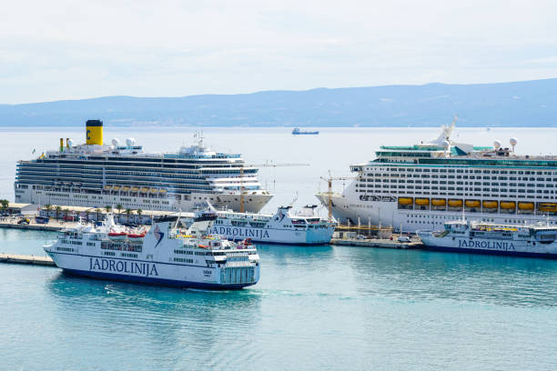 Split, Croatia - September 20, 2024: Cruise ships Costa Deliziosa and Explorer of the Seas, Jadrolinija ferry boats at Split harbor passenger terminal