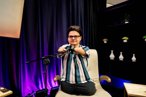 istock Portrait of a young man talking during a podcast at studio 2191212429