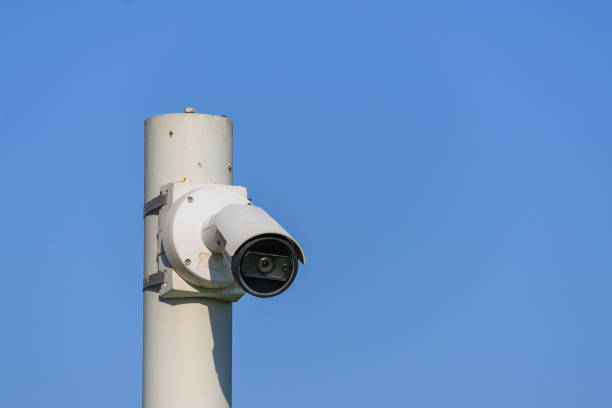 istock Security camera on pole in city center 2191213840