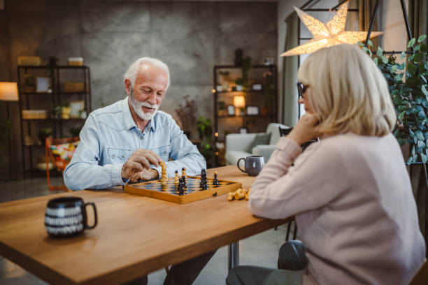 istock senior man analysis next step while play chess with his senior wife 2191217780