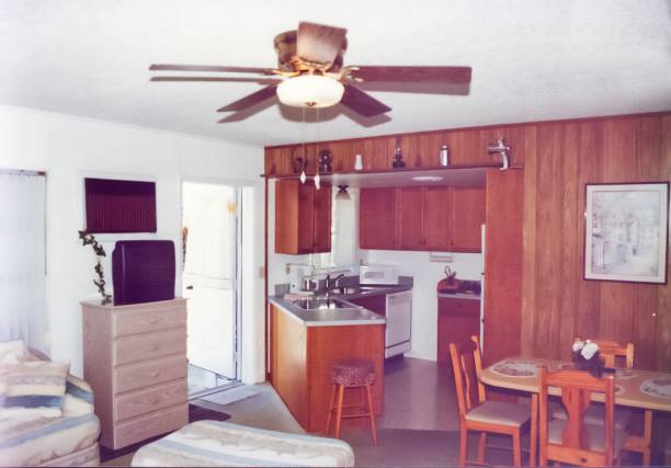 Small kitchen in a studio apartment from the 90s Small kitchen in a studio apartment from the 90s, kitchen, dining room and living room in one room. old fashioned ceiling fans stock pictures, royalty-free photos & images