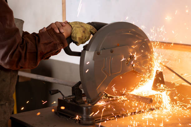 istock craftsman or industrial worker using a miter saw to cut metal 2191220398