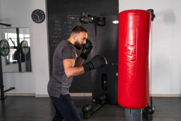 istock Male boxer practicing in the gym 2191220523