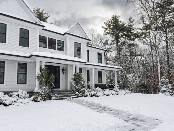 istock Snow covered suburban home 2191221542