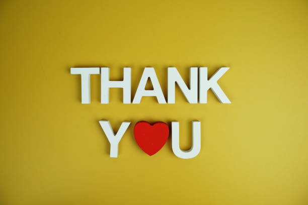 istock Thank You alphabet letters top view on yellow background 2191223548