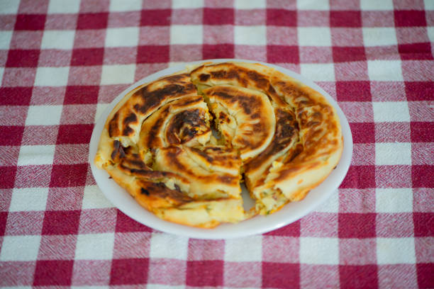 Golden Spiral Borek Cooking on a Stovetop
