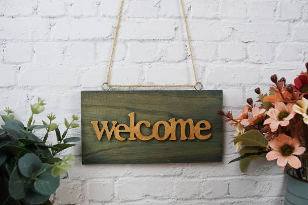 istock Welcome sign Hanging on grunge cement wall background 2191224373