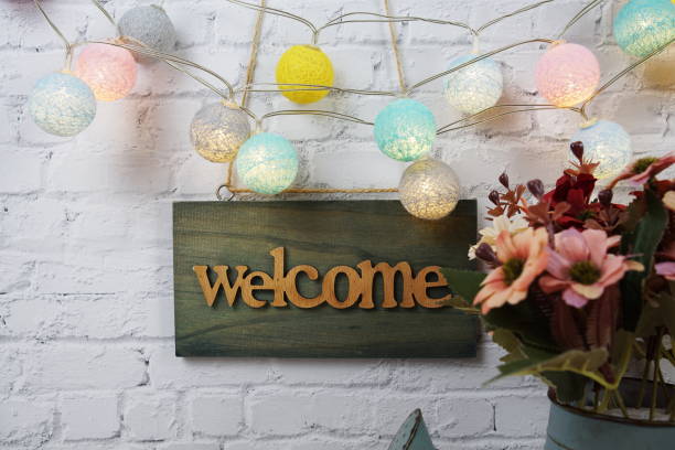 istock Welcome sign Hanging on grunge cement wall background 2191224374