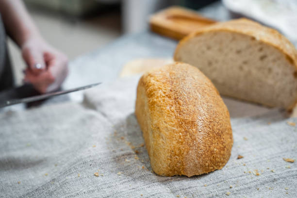 istock Round homemade delicious bread cut in half 2191235863