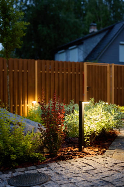 istock The charming garden pathway is beautifully illuminated at night, creating a serene atmosphere 2191236759