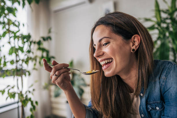 istock A young woman eats oatmeal 2191237701