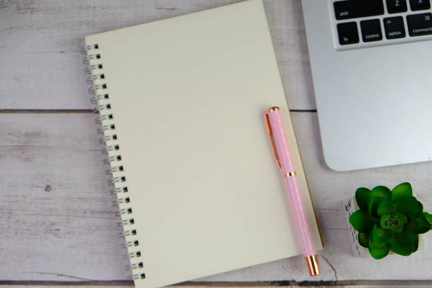 istock flat lay of a blank note book for text space. Educational concept with text space on isolated background. 2191242070