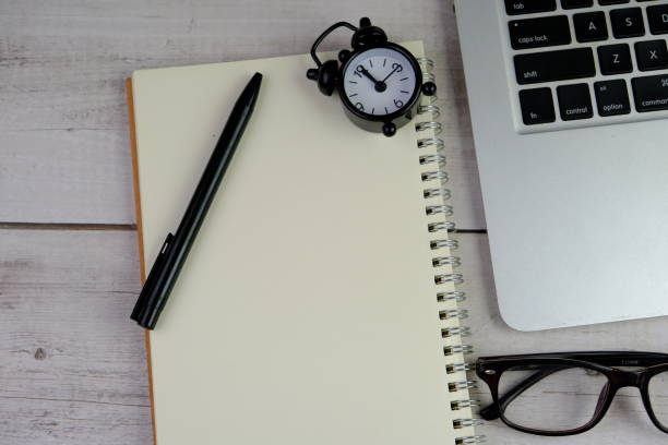 istock flat lay of a blank note book for text space. Educational concept with text space on isolated background. 2191242163
