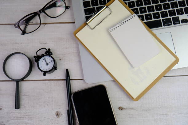 istock flat lay of a blank note book for text space. Educational concept with text space on isolated background. 2191242334