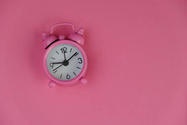 A pink clock that rings