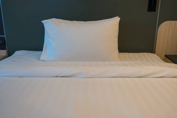 istock Close up of pillows in a bed 2191248530
