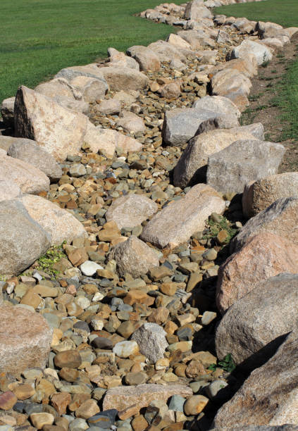 istock Dry streambed creek bed lined with large rocks 2191251967