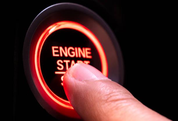 istock The driver's hand is pressing the car start button. Concept of transportation and technology 2191255208