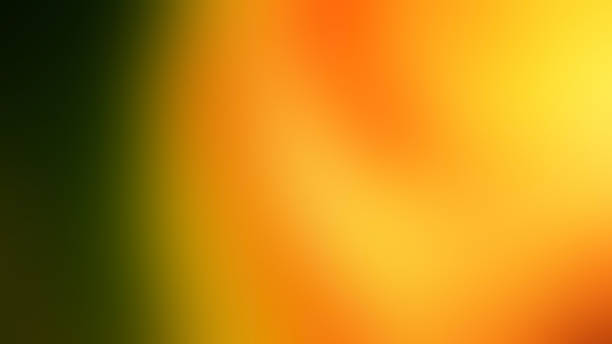 istock Abstract Gradient. A smooth blend of dark green transitioning to warm orange and yellow, creating a soft and vibrant gradient effect. 2191256664