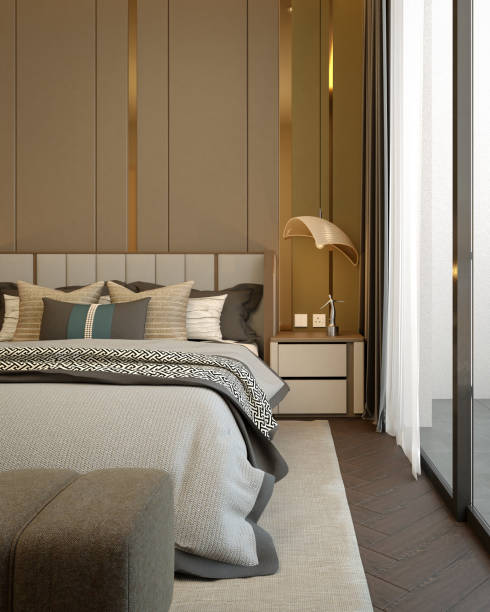 istock A modern, stylish bedroom featuring elegant decor, a cozy bed with decorative pillows, and ample natural light from large windows. 3d rendering. 2191257818