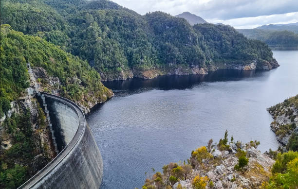 istock Gordon Dam in Tasmania, an impressive concrete structure surrounded by rugged cliffs and a lake in a remote wilderness 2191261571