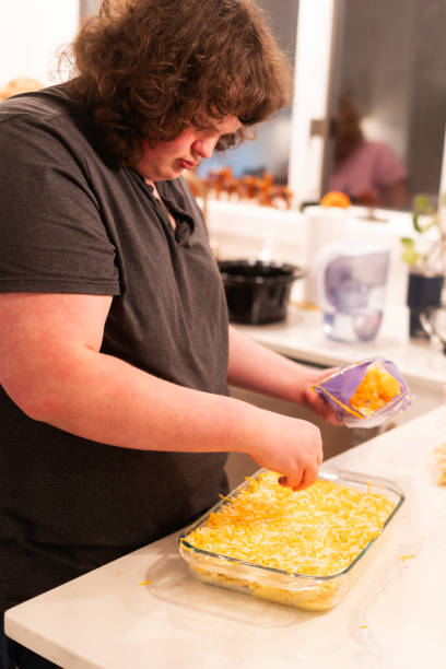 istock Teen making macaroni and cheese 2191262292