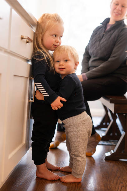 istock Toddler siblings hugging at home 2191262330