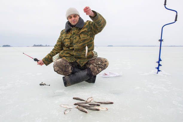 istock A man fishes on the ice 2191262345