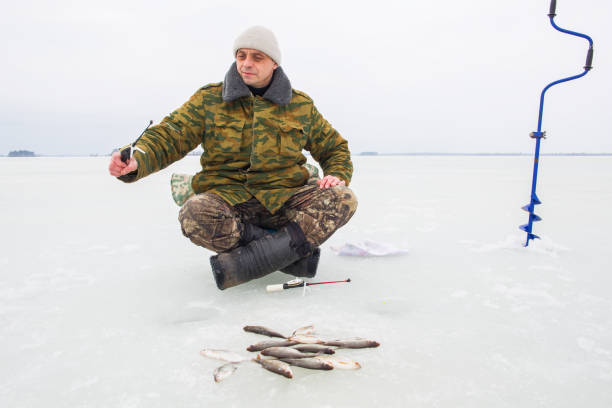 istock A man fishes on the ice 2191262347