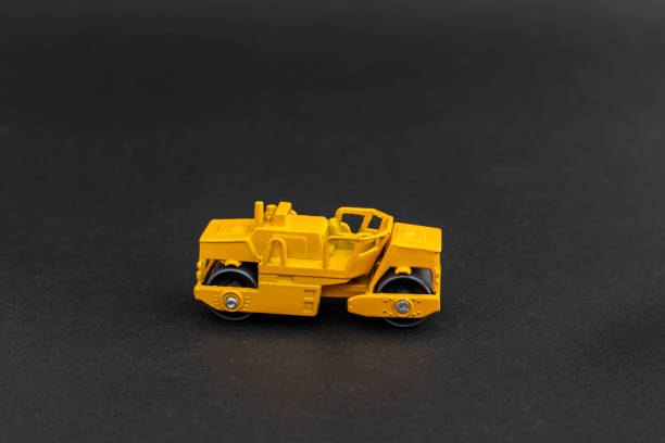 istock Toy heavy machinery.road roller replica on black background 2191262483