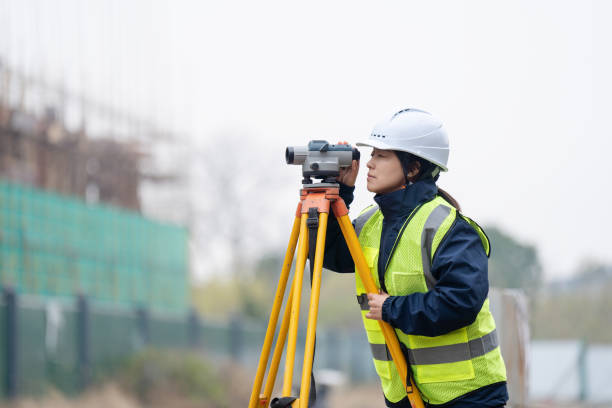 istock Engineer is using a survey camera to measure levels on a construction site 2191263099