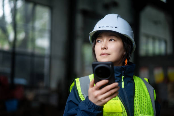 istock asian female engineer working in factory with smart  phone 2191264496