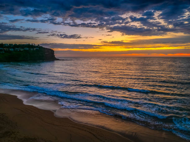 istock Pretty Sunrise at the seaside with rain clouds 2191267318