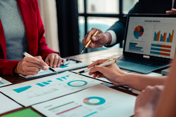 istock Documents and hands on table in conference room in business presentation or seminar Multiethnic group of people working with documents on table in conference room in business presentation or seminar. 2191268572
