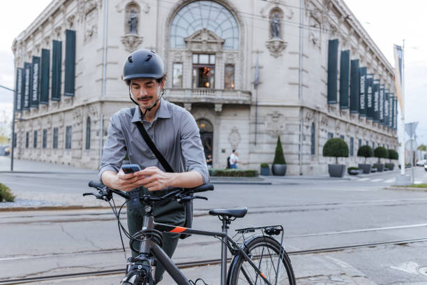 istock Man on the street using phone by the bicycle 2191275778