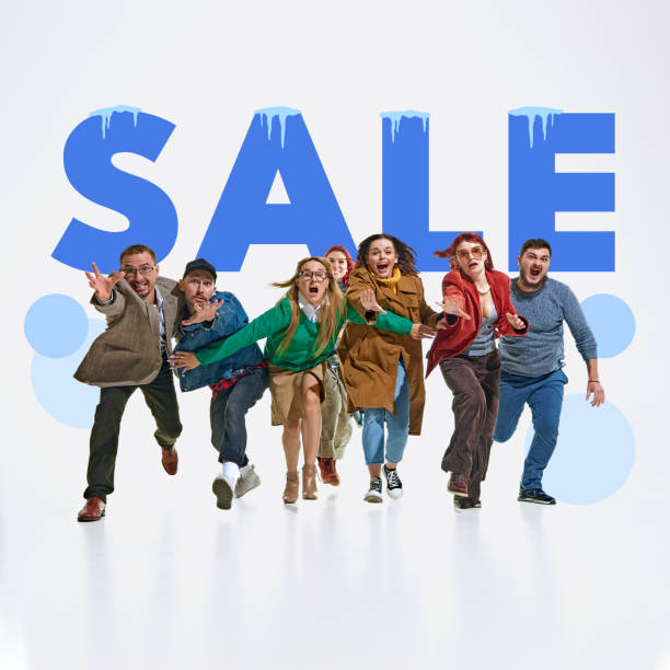 istock Group of emotional people running forward with excited expressions, symbolizing rush for winter sales. Bold typography of word SALE on background 2191281506