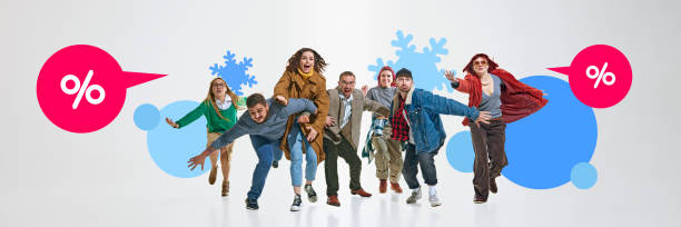 istock Group of people moving forward energetically, chasing after pink discount speech bubbles, surrounded by blue snowflakes and circles. 2191281514