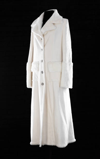 istock white fur coat on mannequin isolated on black background 2191281553